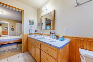 a bathroom with a sink and a toilet and a tub at Eternal Equinox in Sea Ranch +25 photos