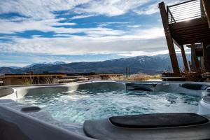 a hot tub with a view of the mountains at Moose Ridge Hideaway Ri903 Ski Retreat Hot Tub in Eden