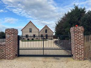 an iron gate in front of a house at Gites les Amourettes in Saint-Aubin-sur-Scie