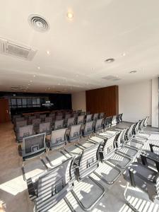 an empty auditorium with chairs in a room at MY HOTEL in Prizren