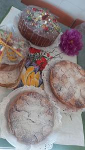 a group of cakes and pastries on a table at B&B Maestra Giovanna in Pompei