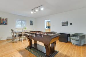 a living room with a foosball table in it at Spacious Chicago Group Home! Walk to Train & Eats in Chicago