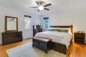 a bedroom with a bed and a ceiling fan at Spacious Chicago Group Home! Walk to Train & Eats in Chicago