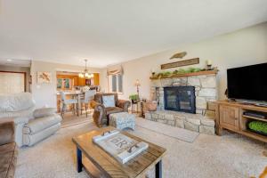 a living room with a couch and a fireplace at Chetola Cardinal 201 in Blowing Rock