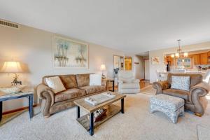 a living room with two couches and a table at Chetola Cardinal 201 in Blowing Rock