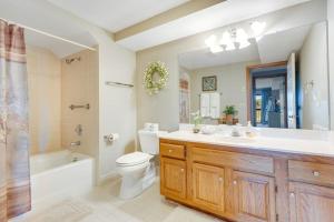 a bathroom with a sink and a toilet and a bath tub at Chetola Cardinal 201 in Blowing Rock +20 photos