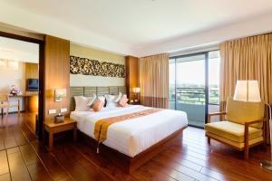 Ένα ή περισσότερα κρεβάτια σε δωμάτιο στο Asia Hotels Group (Poonpetch Chiangmai)