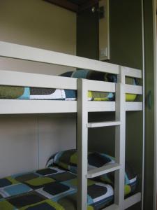 a bunk bed with four bunk beds in a room at Camping Sella in Arriondas