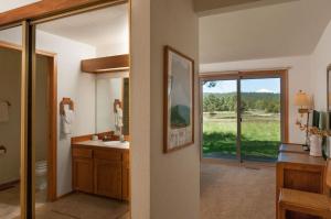 a bathroom with a sink and a large window at 108 Quelah Condo in Sunriver