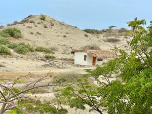a small house in the middle of a mountain at Villa Vichayo Bungalows in San Martín