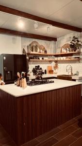 a kitchen with a stove and a counter top at Casa Amanecer in Tonosí +10 photos