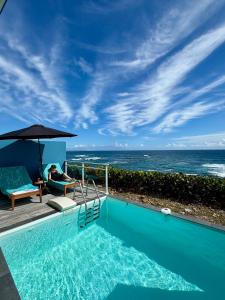 a swimming pool with a view of the ocean at Villa Ar Mor - Oceanfront pool & Saint-Barth view Oyster pond in Saint Martin +26 photos