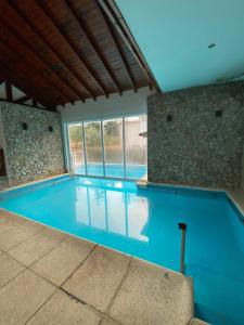 a large swimming pool with blue water at Laderas Verdes in Esquel