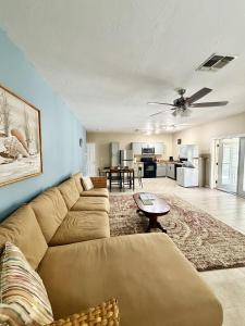 a living room with a couch and a table at Driftwood Getaway Vacation home in Fort Myers Beach
