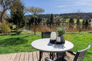 a table with flowers and candles on a patio at Appartement im Weiherhaus in Forchheim
