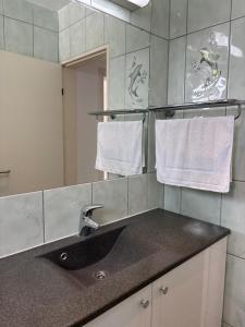 a bathroom with a sink and a mirror and towels at Villa Cherry in Bar +111 photos