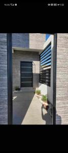 a building with a window and a door on it at Gemela1 in Puerto Peñasco
