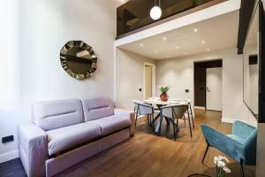 a living room with a couch and a table at Palazzo Venezia in Florence