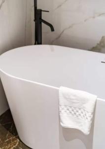 a white bath tub with a towel on it at Palazzo Venezia in Florence +84 photos