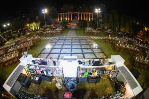 an aerial view of a wedding reception at night at Lunasol venue in Ar Rumayl
