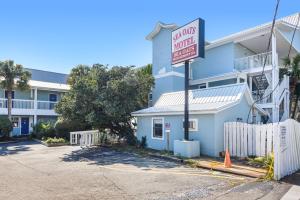 a no parking sign in front of a building at Sea Oats Motel in Destin