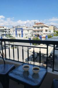 two bowls sitting on a table on a balcony at Mézzo Lago in Missolonghi