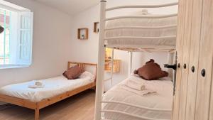 a bedroom with two bunk beds and a window at La Calma de Vilo in Periana +79 photos