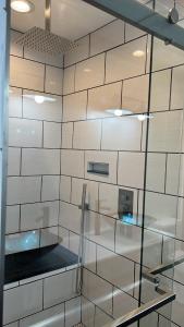 a wall with glass shelves in a room at Retro Retreat in Wilson