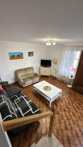 a living room with a couch and a table at Domaine du Mont des Chênes in Monthou-sur-Cher