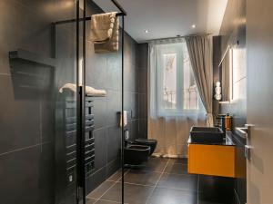 a bathroom with two toilets and a window at MYō in Dorno +53 photos