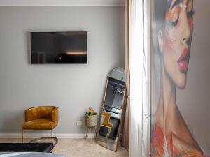 a room with a painting of a woman in a dress at MYō in Dorno