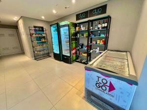 a store with two soda machines in a room at Town Co - Apartment 1004 in Porto Alegre