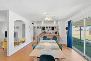 a dining room and living room with a table and chairs at Tempe Resort, Pool with Diving Board, 4BR in Tempe