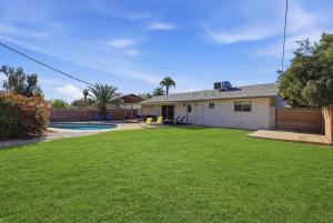 a house with a yard with a pool at Tempe Resort, Pool with Diving Board, 4BR in Tempe
