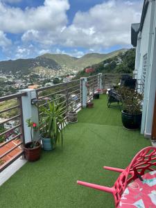 a balcony with a view of a city at B's Hidden Paradise in Philipsburg