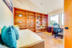 a bedroom with a bed and a desk and a chair at Seaspray in Sea Ranch +27 photos