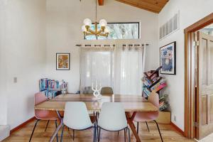 a dining room with a wooden table and chairs at Hilma House in Sea Ranch