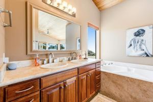 a bathroom with two sinks and a large mirror at Da Yaya House in Sea Ranch +40 photos