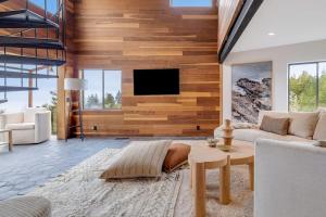 a living room with a couch and a tv at Sequoia Vista in Gualala