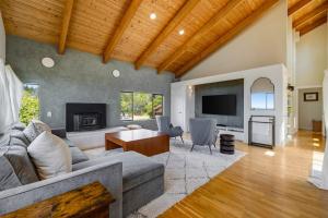 a living room with a couch and a table at SeaRenity in Sea Ranch
