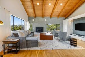 a living room with a couch and a table at SeaRenity in Sea Ranch +31 photos
