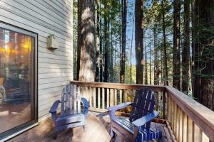 two chairs sitting on the porch of a house at Deep Woods Hideaway in Annapolis +17 photos