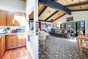two views of a kitchen and a living room at Eagle's Landing - Main House & Studio in Gualala