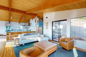 a living room with a couch and a chair at Coffee by the Sea in Sea Ranch