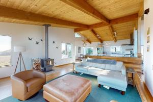 a large living room with a couch and a table at Coffee by the Sea in Sea Ranch +33 photos
