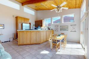 a kitchen with a table and a dining room at Elizabeth Dane in Sea Ranch