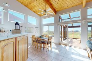 a kitchen and dining room with a table and chairs at Elizabeth Dane in Sea Ranch