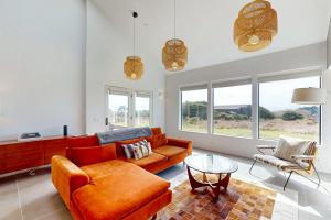 a living room with a couch and a table at Blue Mermaid in Sea Ranch