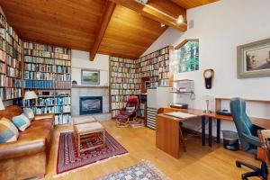 a living room filled with lots of books at Schooner in Sea Ranch