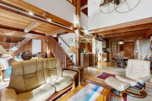 a living room with a couch and a table at Schooner in Sea Ranch
